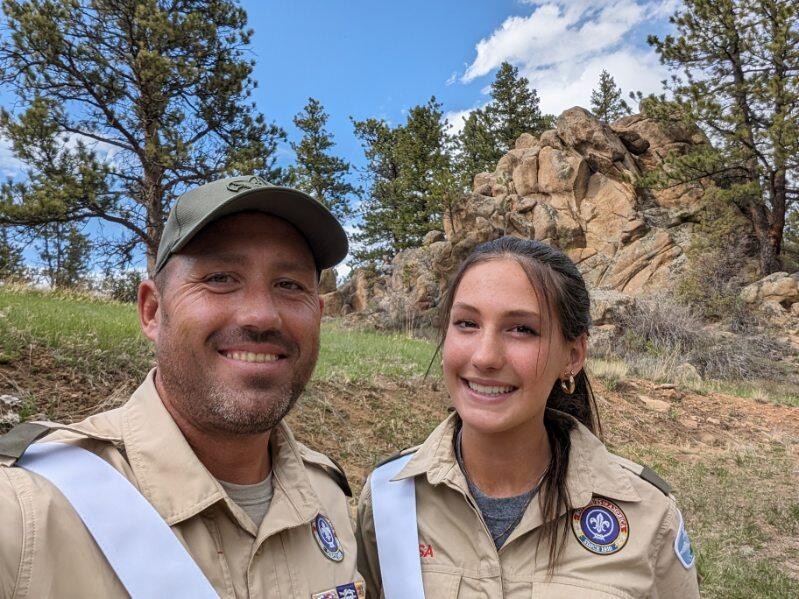 Cora with her father in Scout uniforms