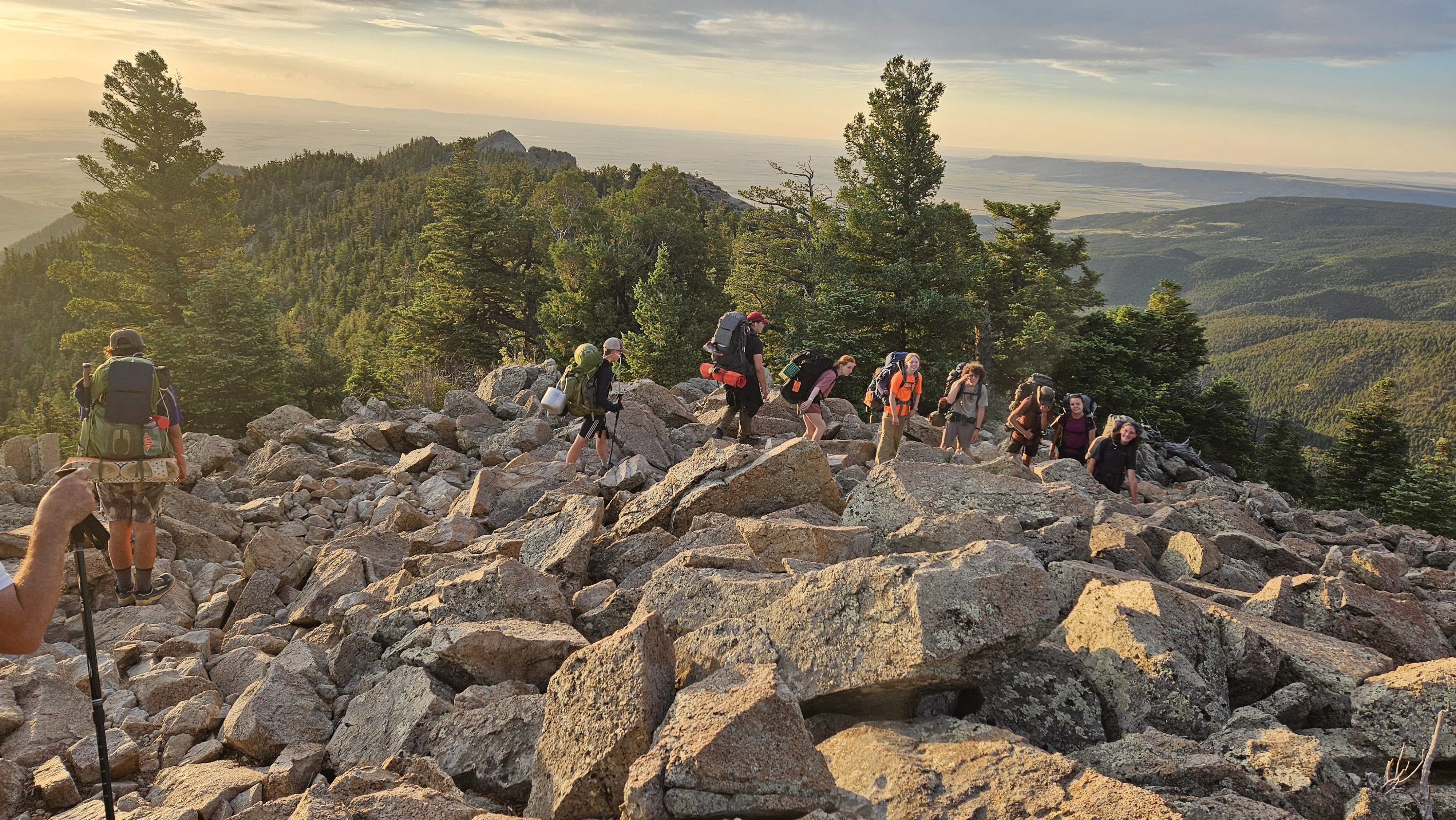 Group hiking a rocky mountain trail