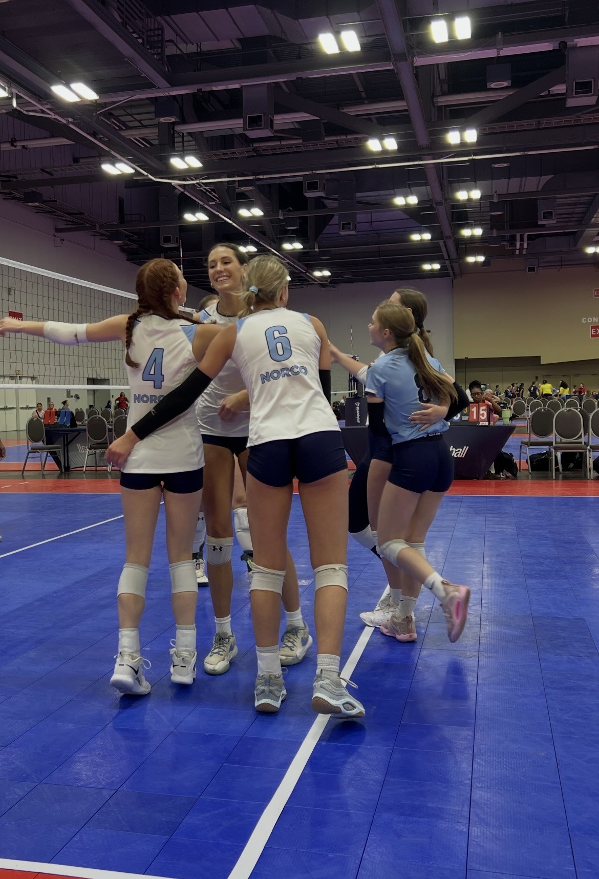 Cora playing volleyball in a match